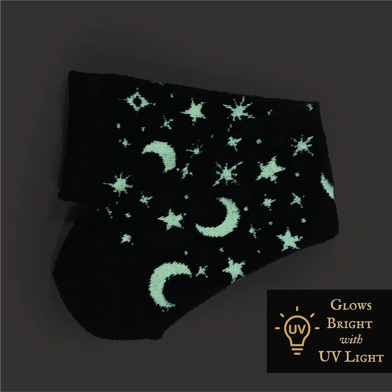 Black socks with green star and moon patterns on a dark background, labeled 'Glowing with UV Light'.
Celestial glow-in-the-dark cozy socks with star and moon pattern by Velanyx

Soft plush gripper socks that glow in the dark in celestial design

Black cozy socks with glow star pattern and non-slip bottoms

Witchy celestial glow socks perfect for cozy nights and gifting

Velanyx glow-in-the-dark star socks ultra soft plush material